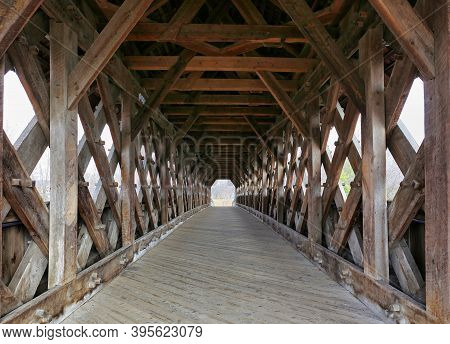Interior Of Covered Bridge With Opening At The End In Guelph, Ontario.