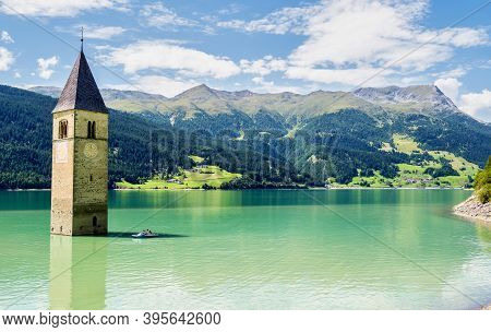The Famous Bell Tower In The Lake Of Reschen - Lago Di Resia In South Tyrol, Italy. During Ww2 A Dam