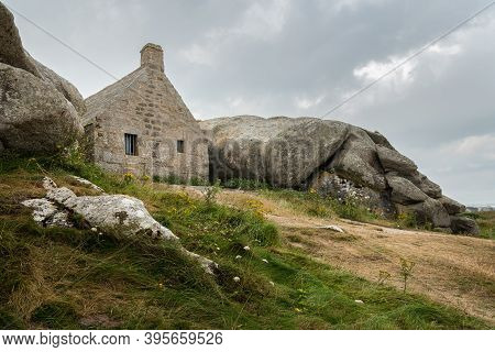 House Between Rocks In Meneham On The Atlantic Coast In Northern Brittany (france), Cloudy Day In Su