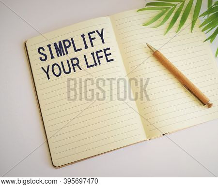 Simplify Your Life Word Written In Notebook.conceptual Hand Writing Showing Simplify Your Life. Busi
