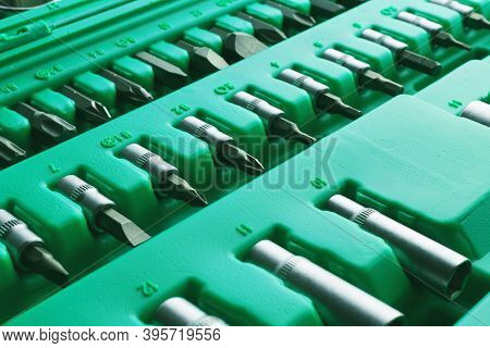 Mechanics Tool Set And Mechanic's Tool Box Close-up. Plastic Green Storage Box Case. Mechanics Tool