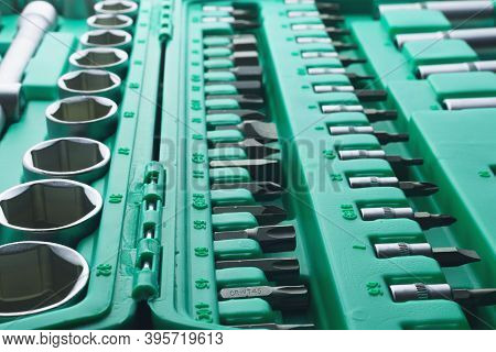 Mechanics Tool Set And Mechanic's Tool Box Close-up. Plastic Green Storage Box Case. Mechanics Tool