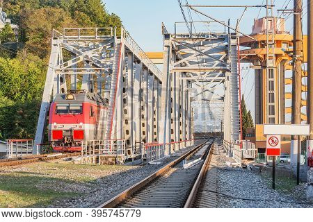 Passenger Train Moves Through The Bridge. Sochi.. Russia.