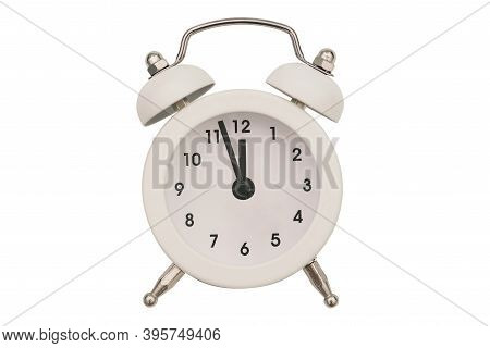 Alarm Clock Close-up Isolated On A White Background. White Round Clock. The Hands Of An Old Alarm Cl