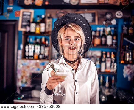Girl Bartender Mixes A Cocktail On The Beerhall