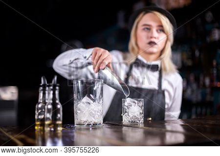 Young Woman Bartending Demonstrates His Professional Skills In The Night Club