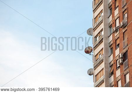 Satellite Dish Tv Uhf Antennas On Display At The Top Of A Traditionnal Communist Housing In The Subu