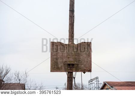Old, Half Destroyed, Rotten Basketball Backboard, In A Decaying Sports Playground, Standing During A