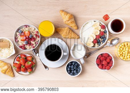 Healthy Breakfast Set On Wooden Background. The Concept Of Delicious And Healthy Food. Mix Nuts, Hon
