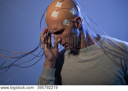 Man With Electrodes In His Head Is A Futuristic Concept Of Virtual Reality And Mind Control. Neuro I