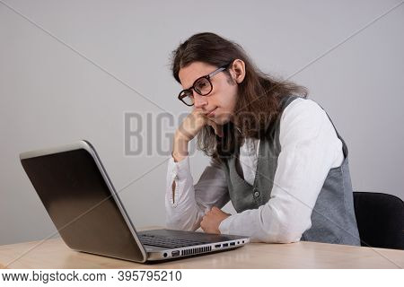 Geek Guy Is Trying To Write Code Or Learn A New Programming Language, Experience Difficulties In The