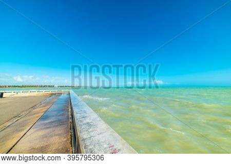 Pier In Higgs Beach Under A Clear Sky. Key West, Florida