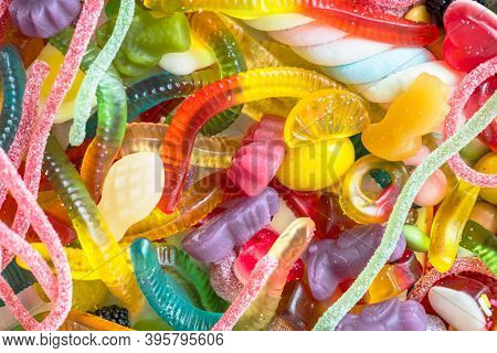 Closeup of colorful assorted jelly worms and other candies