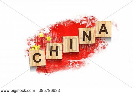 China. The Inscription On Wooden Blocks, Against The Background Of The Flag Of China. Isolated On A 