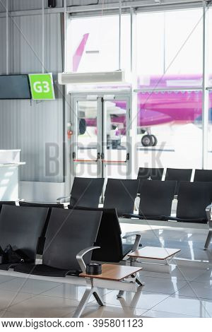 Black Seats In Departure Lounge In Modern Airport, Stock Image