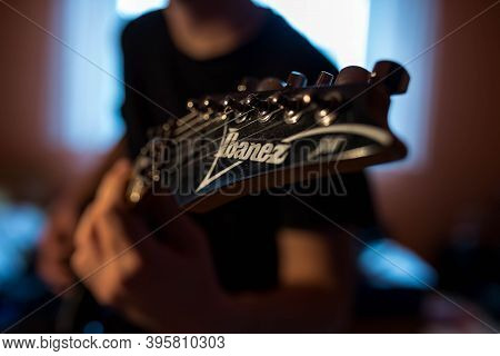 Miercurea Ciuc, Romania- 21 November 2020: Young Musician Playing On Ibanez Electric Guitar.