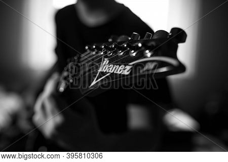 Miercurea Ciuc, Romania- 21 November 2020: Monochrome Image, Young Musician Playing On Ibanez Electr