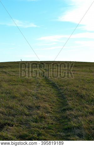 View Behind The Footpath Rising Autumn Meadow To The Horizon With Blue Sky And White Clouds, Karvina