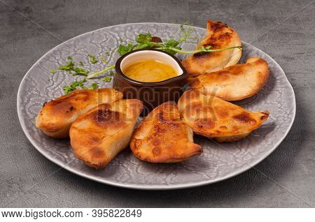 Small Pies With Meat And Mustard Sauce