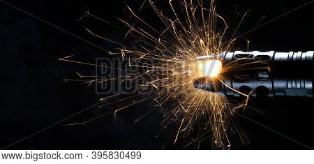 Sparks Flying From A Muzzle Brake On A High Powered Rifle