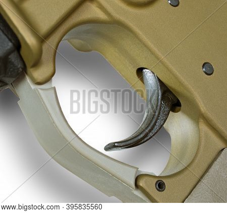 Shadow Of An Ar-15 Trigger On A White Background