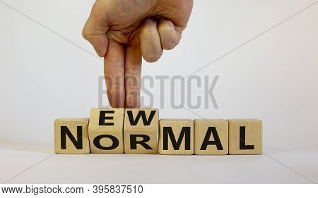New Normal And Covid-19 Pandemic Concept. Words 'new Normal' On Wooden Cubes On A Beautiful Wooden T