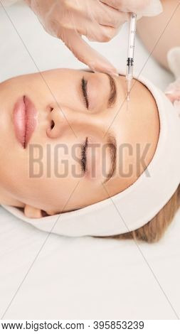 Forehead Injection At Spa Salon. Doctor Hands. Closeup. High Quality. Pretty Female Patient. Beauty 