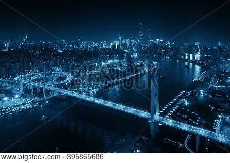Shanghai Nanpu Bridge over Huangpu River with busy traffic in China.