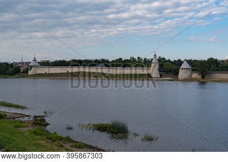 Varlaam, The High And The Flat Tower In Pskov Krom (kremlin). River Pskova Creek. Russia