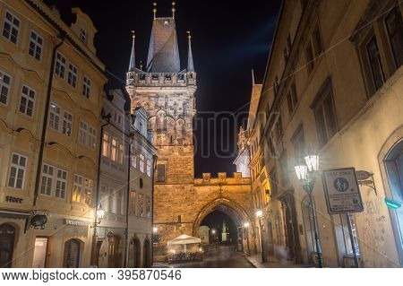 Prague, Czech Republic - July 9, 2020: Malostranska Tower And Old Buildings On Mostecka Street At Ni