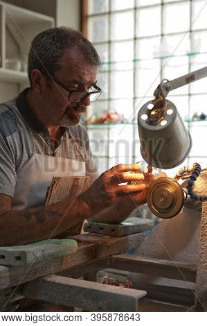 A Craftsman Working In The Sculpting Department At The Waterford Crystal Factory, In The City Of Wat