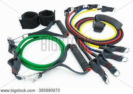 A Set Of Colorful Resistance Bands,door Anchor And Foot Ring Isolated On The White Background.
