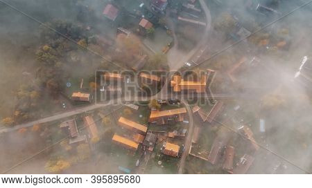 Aerial View Of A Small Village In Fog.top View Of Traditional Housing Estate In Czech.looking Straig
