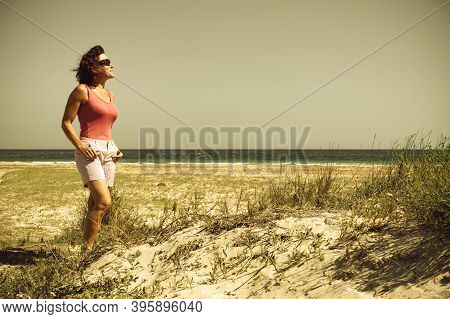 Mature Woman Walking On Beach, Relaxing At San Pedro Del Pinatar Park, Murcia Spain. Summer Holidays