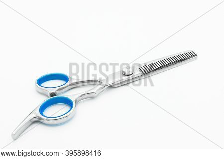 Close-up View Of The Teeth Blade Scissor Isolated On White Background.
