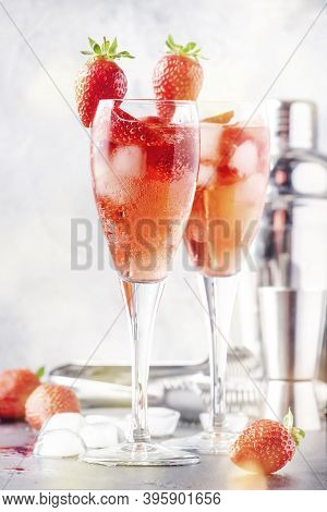 Rossini Italian Red Alcoholic Cocktail With Sparkling Wine, Strawberry Puree And Ice In Champagne Gl