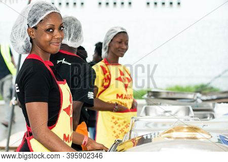 Abidjan, Ivory Coast, September 11, 2016: Young Women Waitresses To Restore Grilling Feast Of Abidja