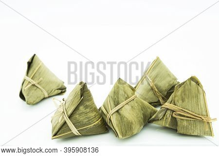 Closeup View Of The Zongzi (sticky Rice Dumplings), It Is A Traditional Chinese Rice Dish Made Of Gl
