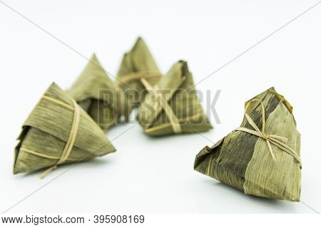 Closeup View Of The Zongzi (sticky Rice Dumplings), It Is A Traditional Chinese Rice Dish Made Of Gl