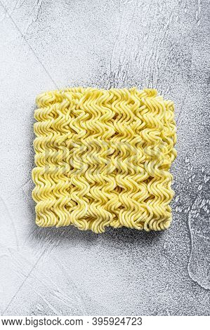 Dry, Raw Quick Cooking Noodle, Instant Noodles. White Background. Top View