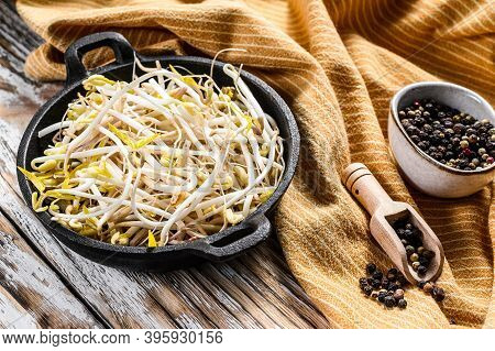 Raw White Organic Bean Sprouts In A Bowl. White Background. Top View