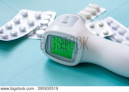 Surface Thermometer For Diagnostic Human Body Temperature. Concept Of Illness And Having Fever Or Ca