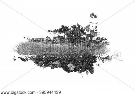 A Sample Of Black Eye Shadow. Cosmetic Product Isolated On White Background. Closeup Of A Makeup Pro