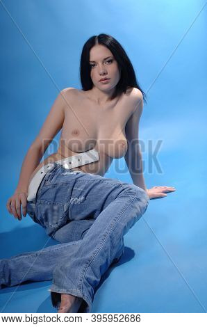 Sexy Naked Woman Undressing Showing Hot Nude Breasts And Naked Buttocks Wearing Blue Jeans