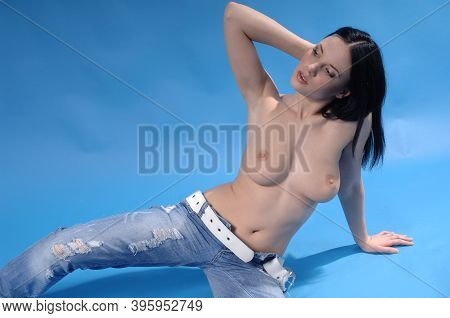 Sexy Woman Lying Nude On Ground Showing Naked Breasts Nipples And Lying On Ground Wearing Blue Pants