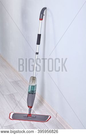 Cleaning Tool For Wet Mopping Of Floors. Spray Mop With Built-in Water Reservoir And Trigger On The 