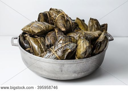 Tasty Tamales Wrapped In Bijao Leaf; Photo On White Background.