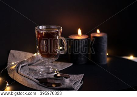 Cup Of Tea And Aromatic Candles In The Dark