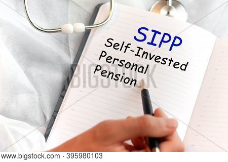 Doctor Holding A Card With Text Sipp Self-invested Personal Pension Medical Concept