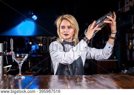 Experienced Girl Tapster Adds Ingredients To A Cocktail